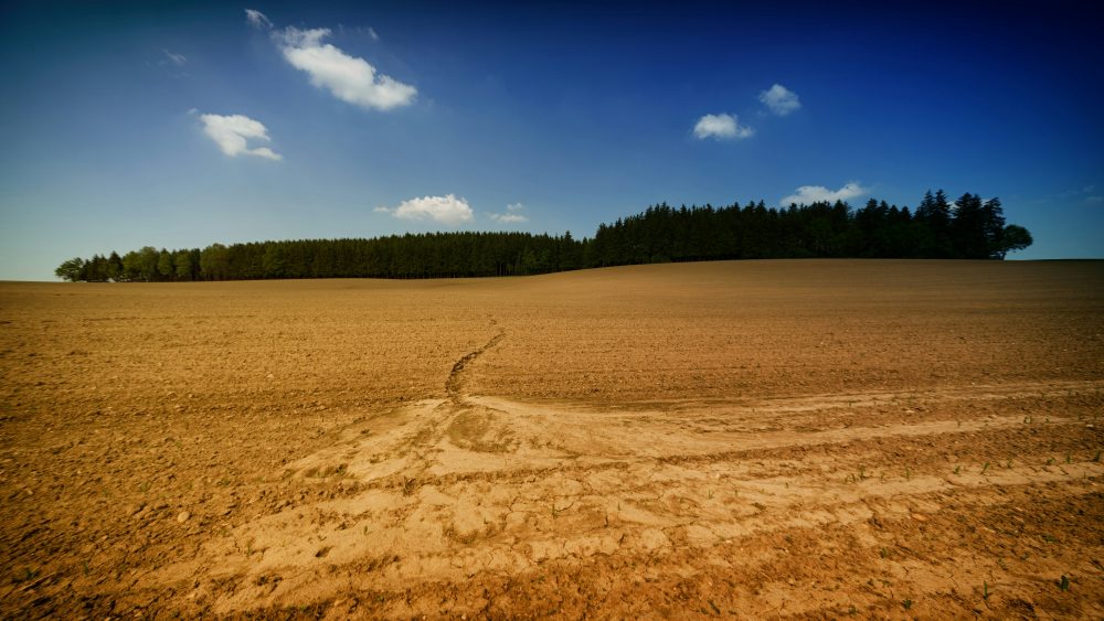 A landscape with soil under a blue sky. Photo